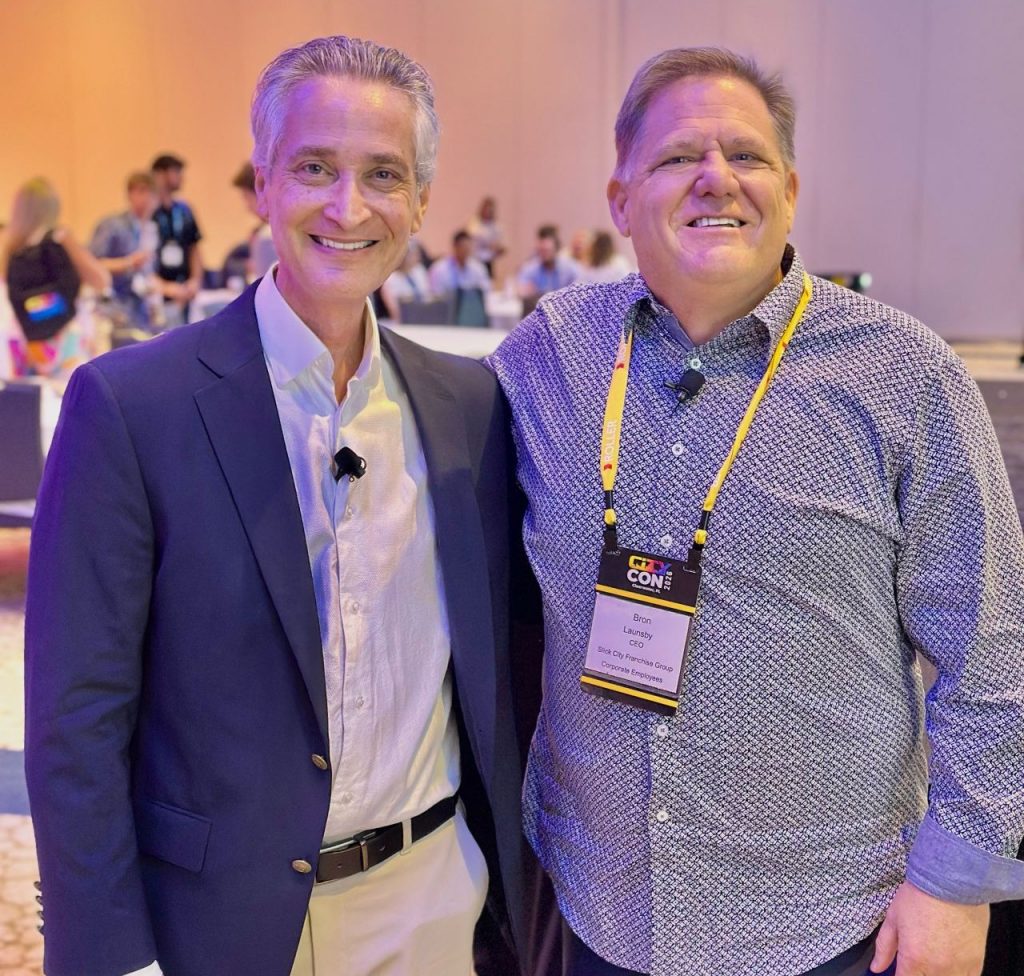 Keynote speaker Scott Greenberg with Slick City CEO Bron Launsby at the CityCon franchise convention